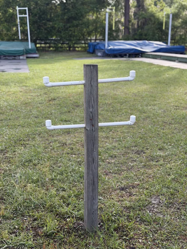 DIY pole tree made from a 4x4 post with PVC pipe racks